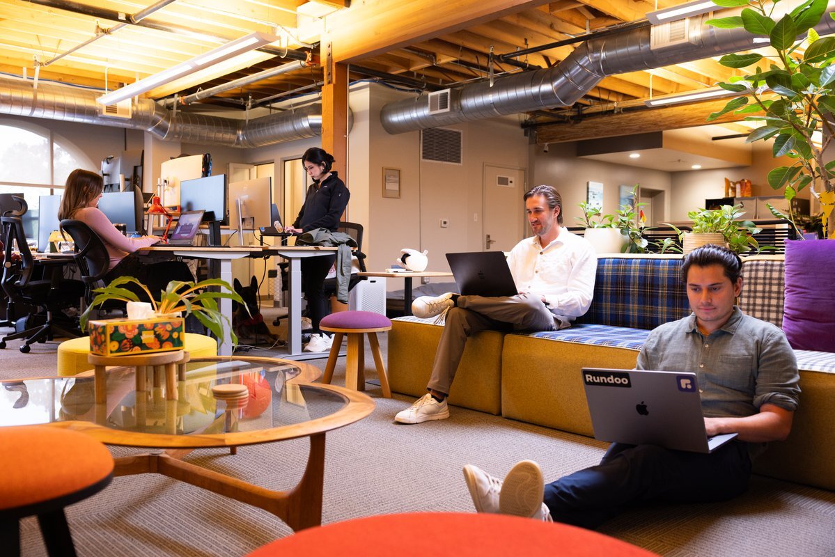 Dooers working together in the Rundoo office lounge
