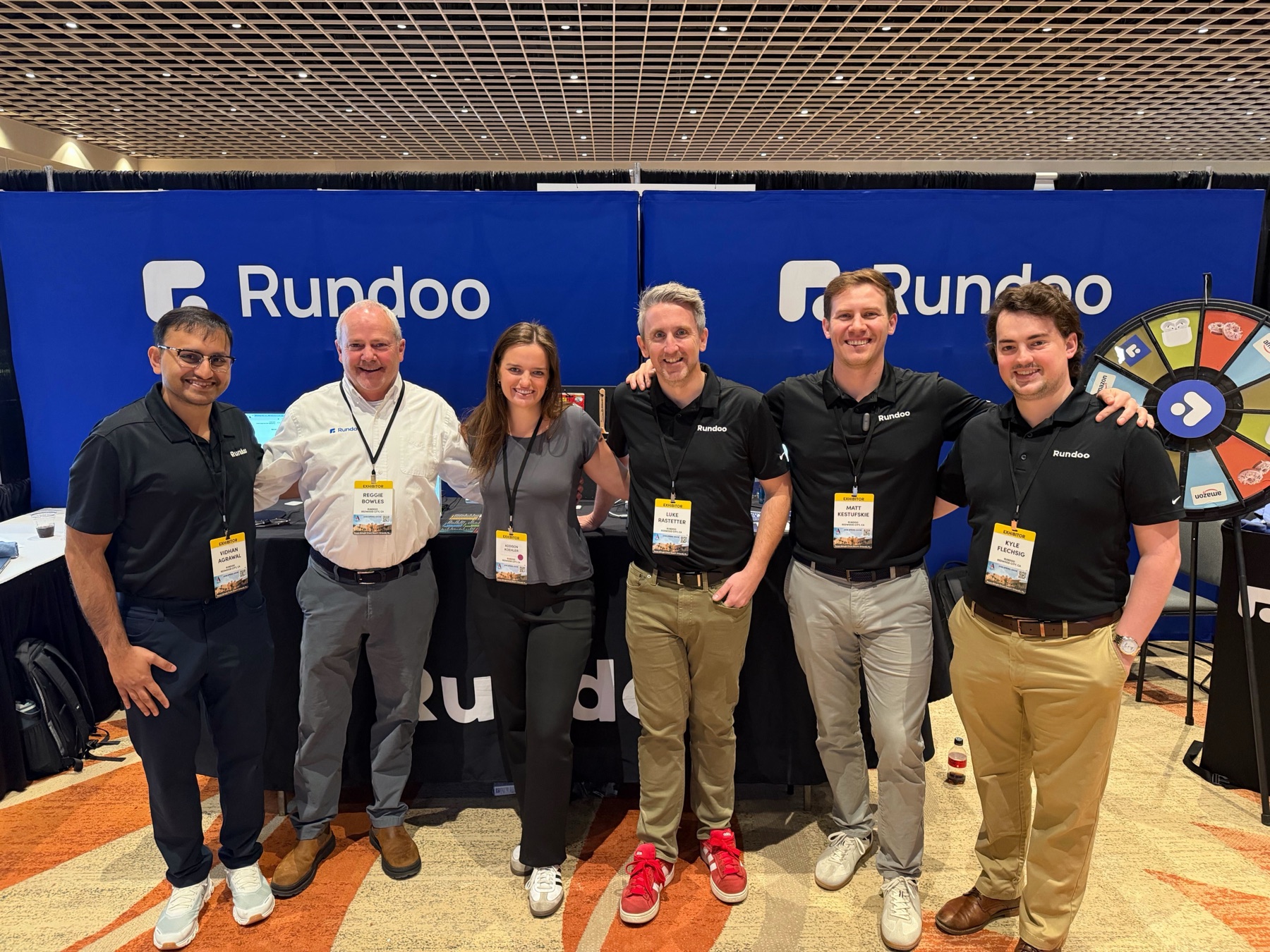The Rundoo team at the Rundoo booth at an ALLPRO show.