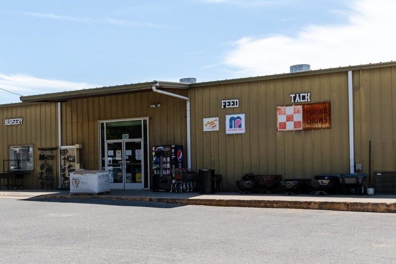 The Spence Ranch Feed Supply storefront, with Nursery, Feed and Tack signs over the doors.